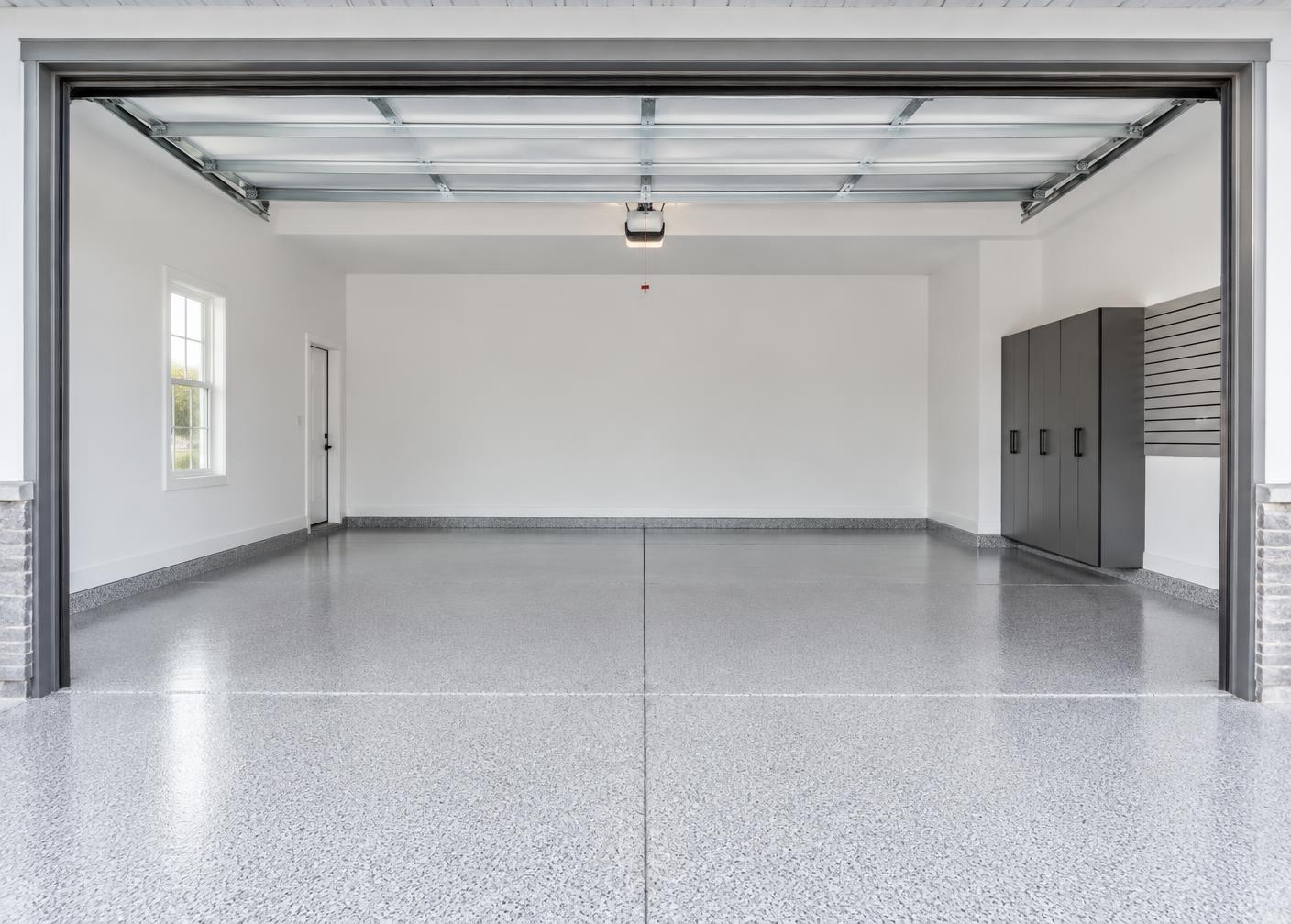 Immaculate garage in an upscale home with a finished flake floor